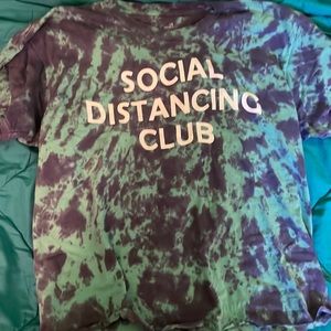 purple and turquoise tye dye “social distancing club” shirt